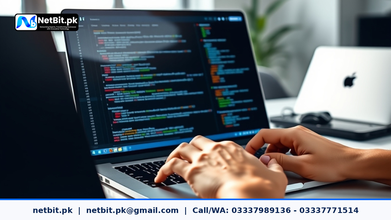 IT technician reviewing code and deployment logs on an office laptop | NetBit Software House and Technology | netbit.pk